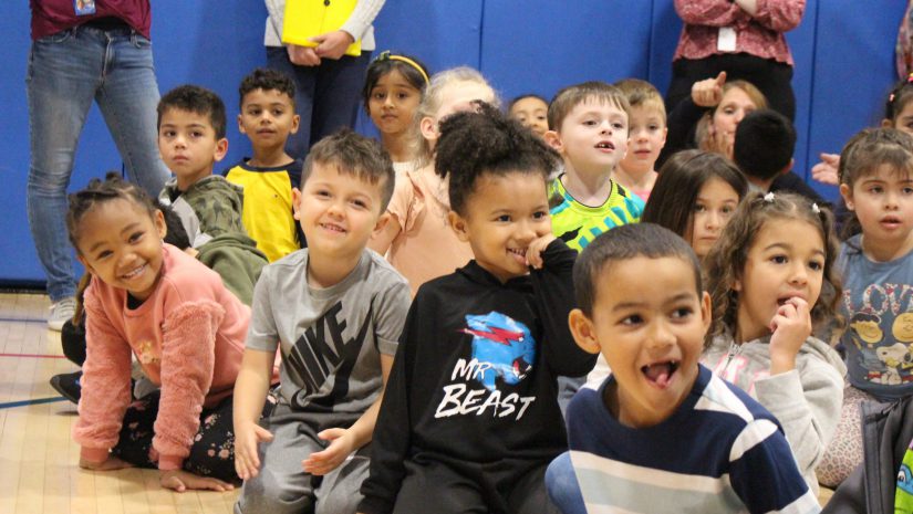 a group of students are smiling