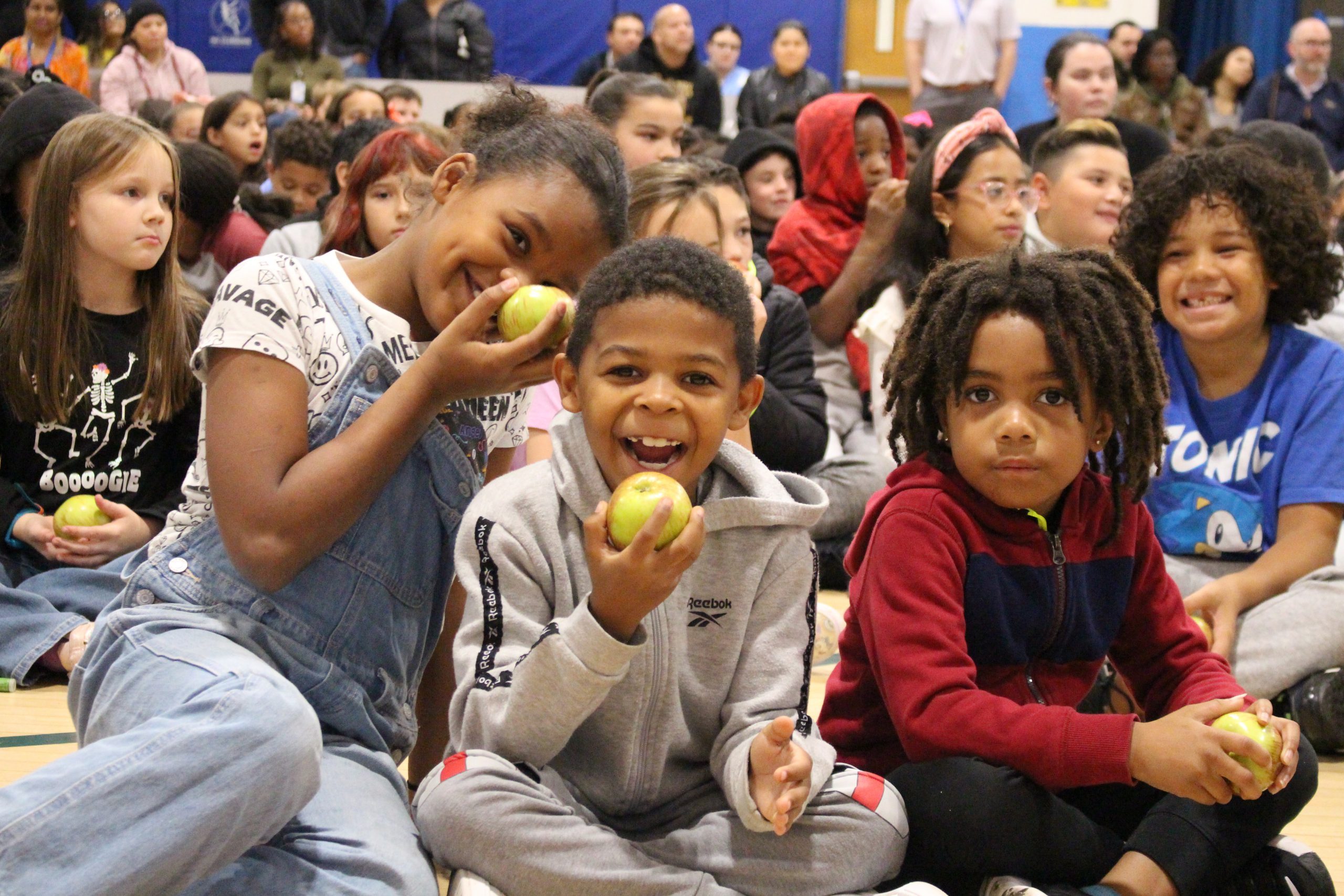 students are about to bite into an apple