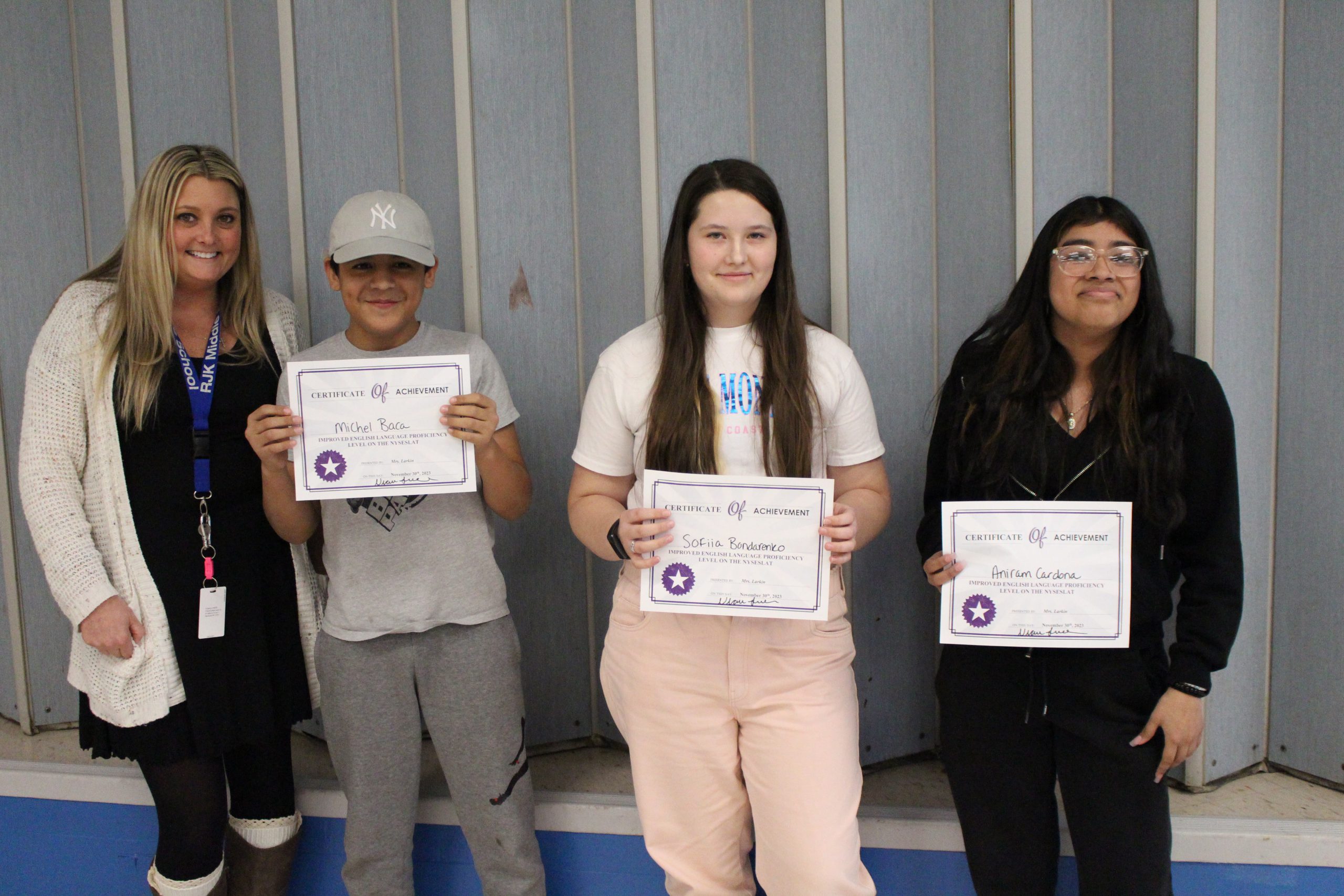 ENL students are posing with their teachers