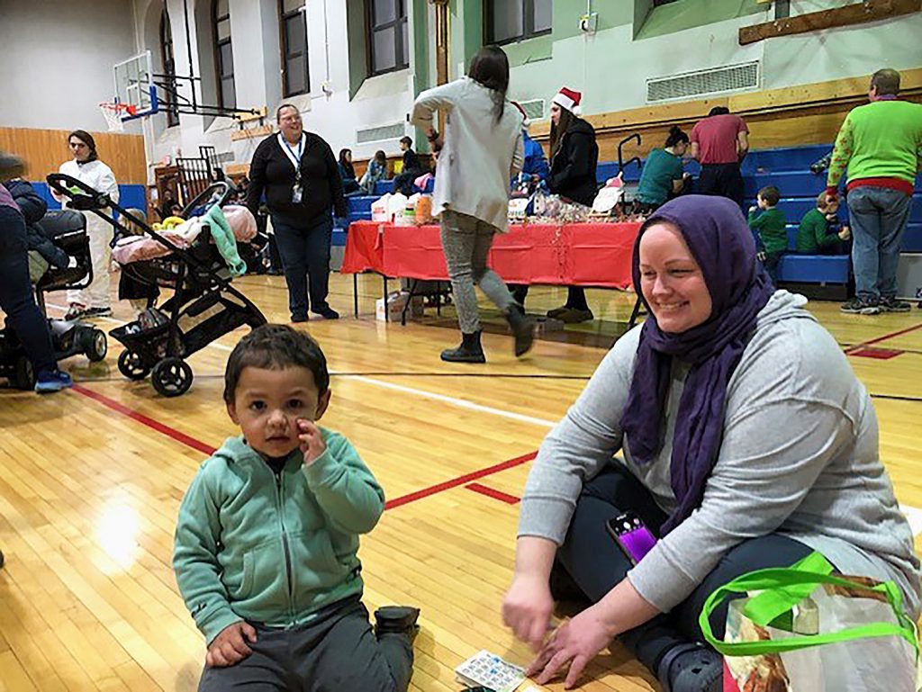 Mother and son smiling.