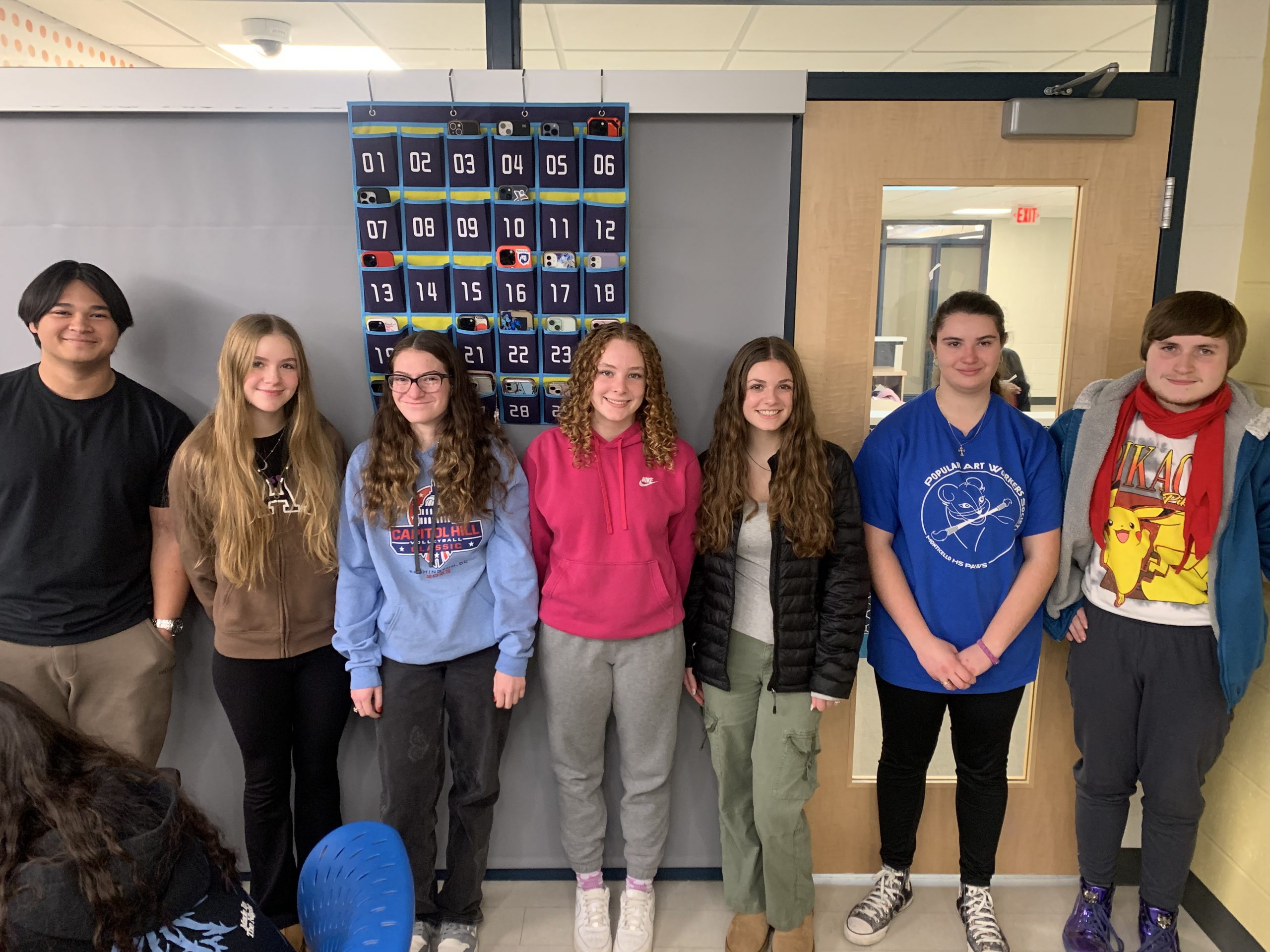 students are posing in a classroom 