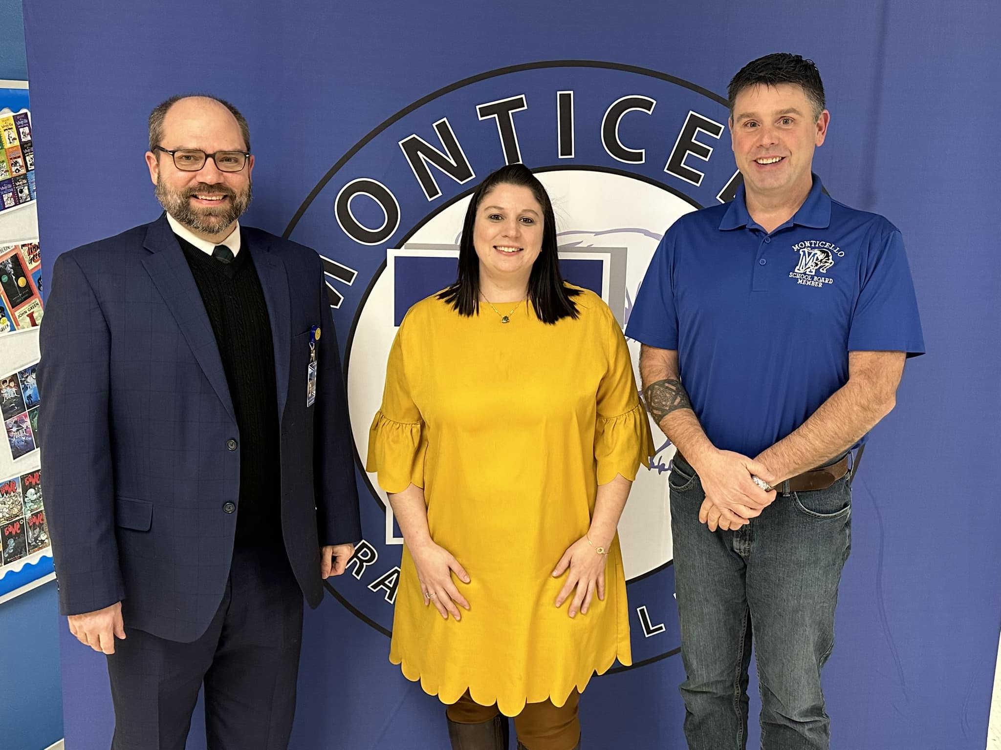 Laura Zanrucha poses with the Superintendent and Board of Education president. 