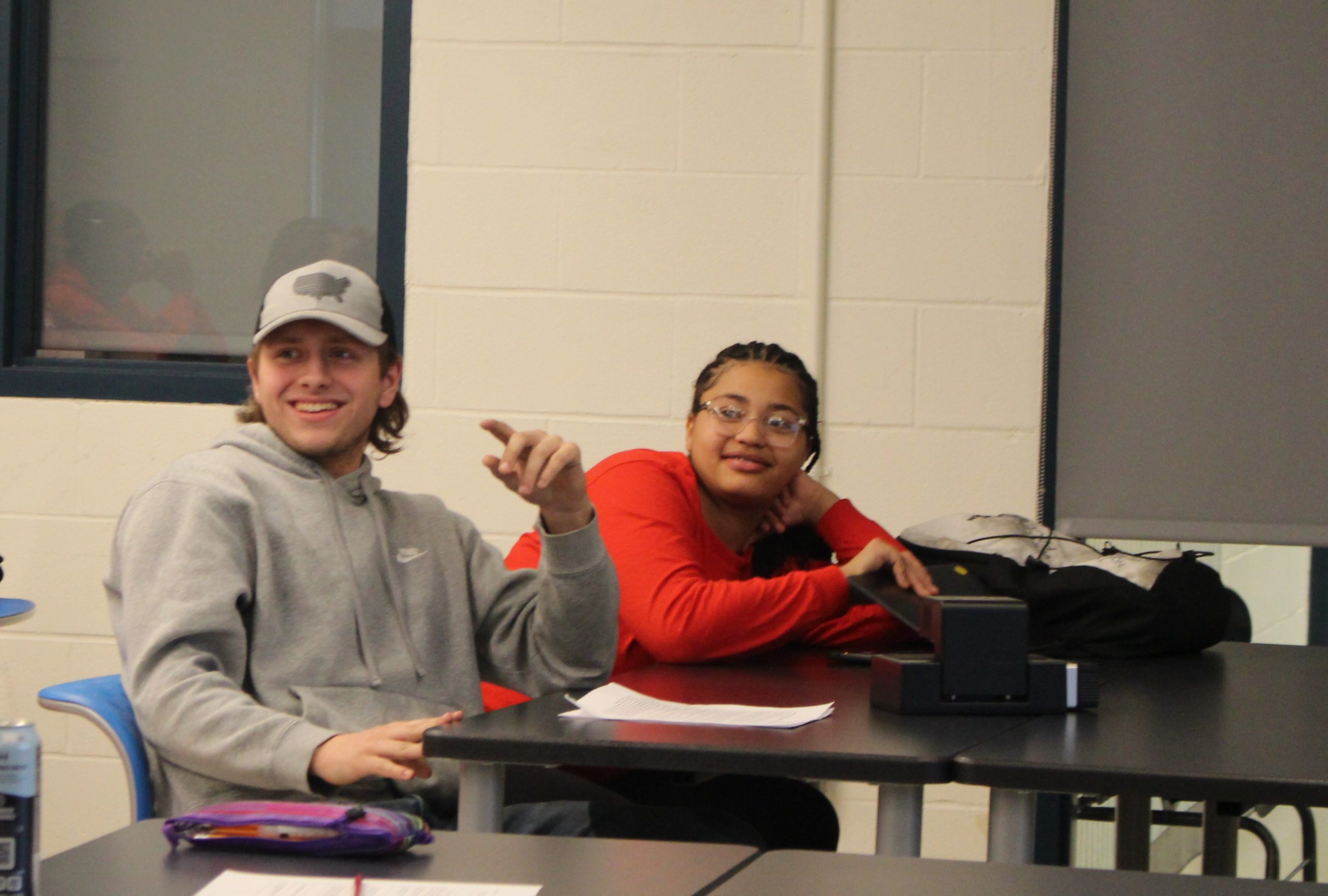 two students are engaged in a discussion. 