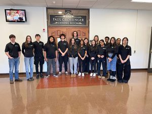 Academy of Finance students standing for a group photo together.