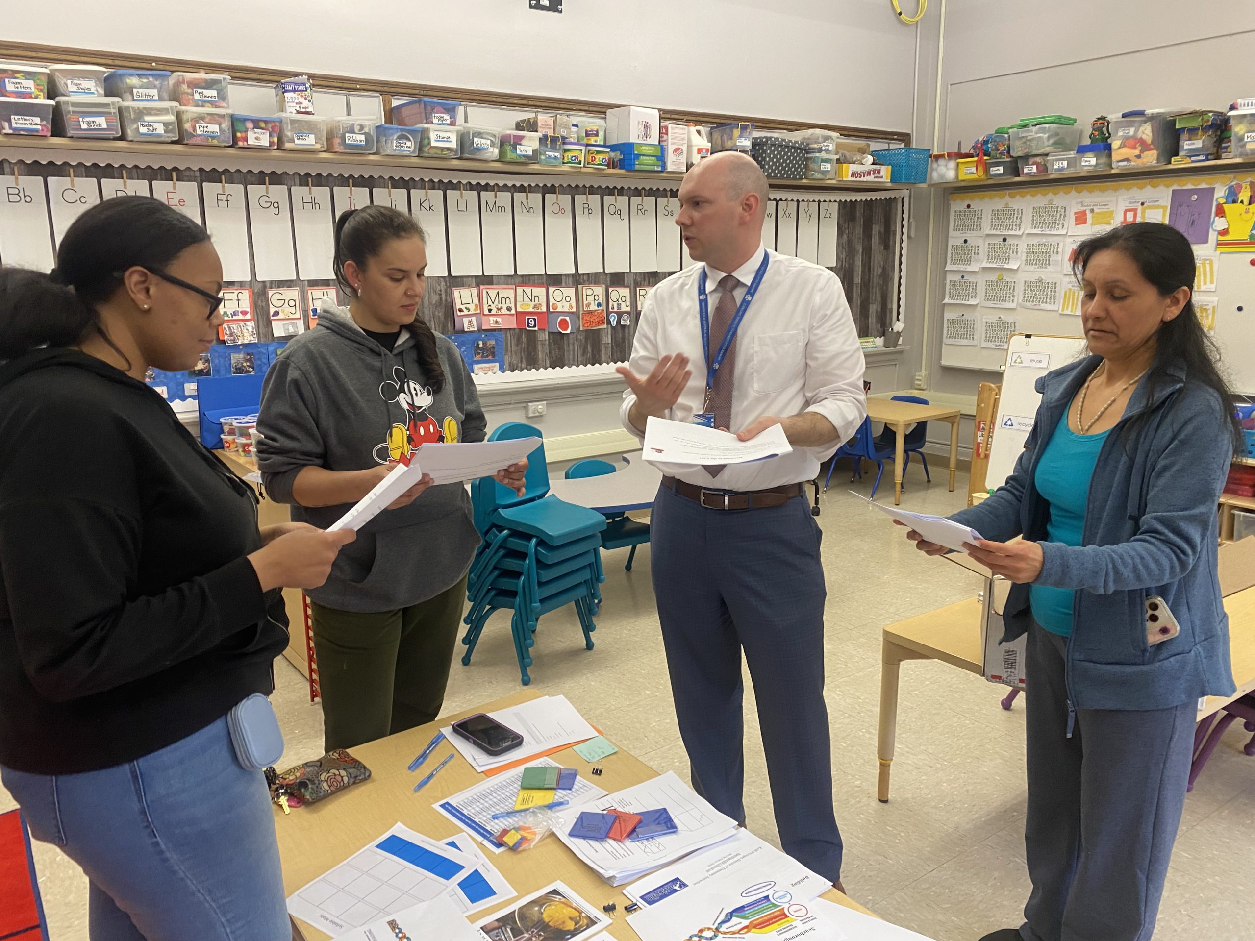 director keith petzinger speaks to three parents. 