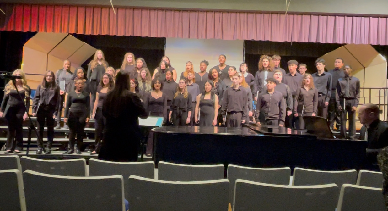 a chorus is performing on stage