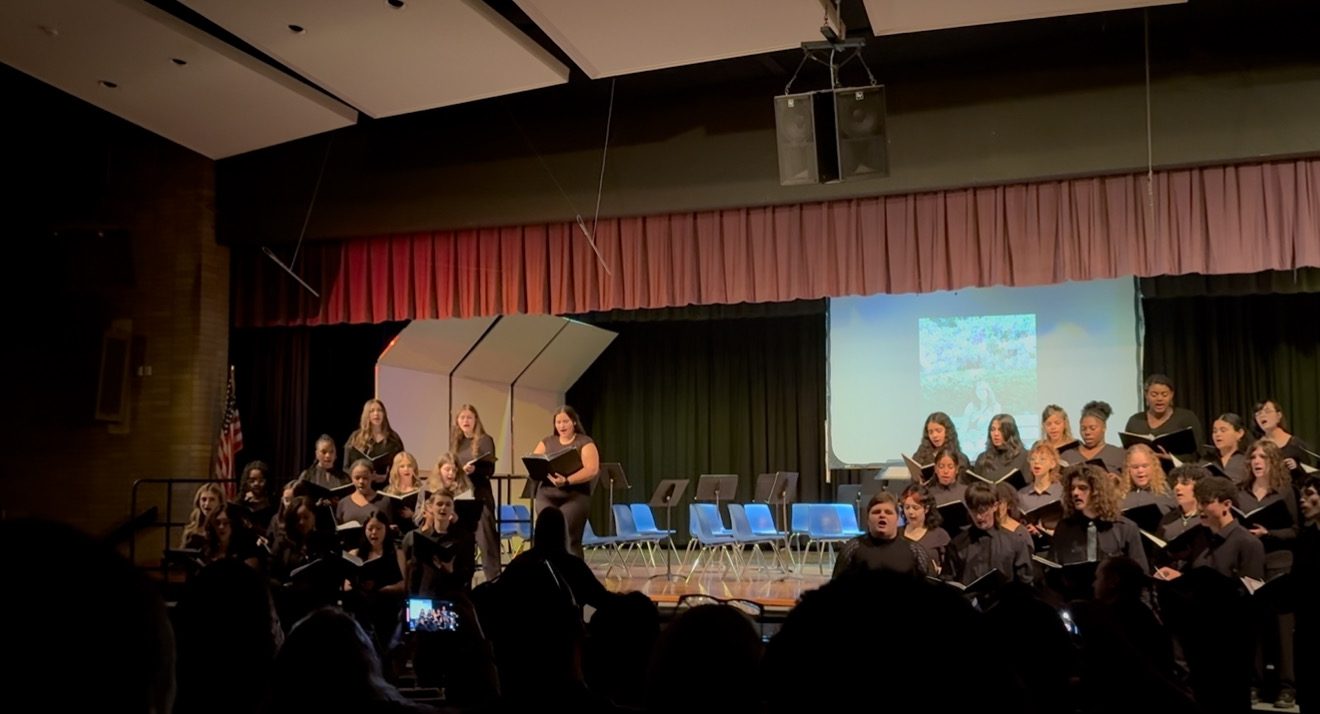 students perform on stage