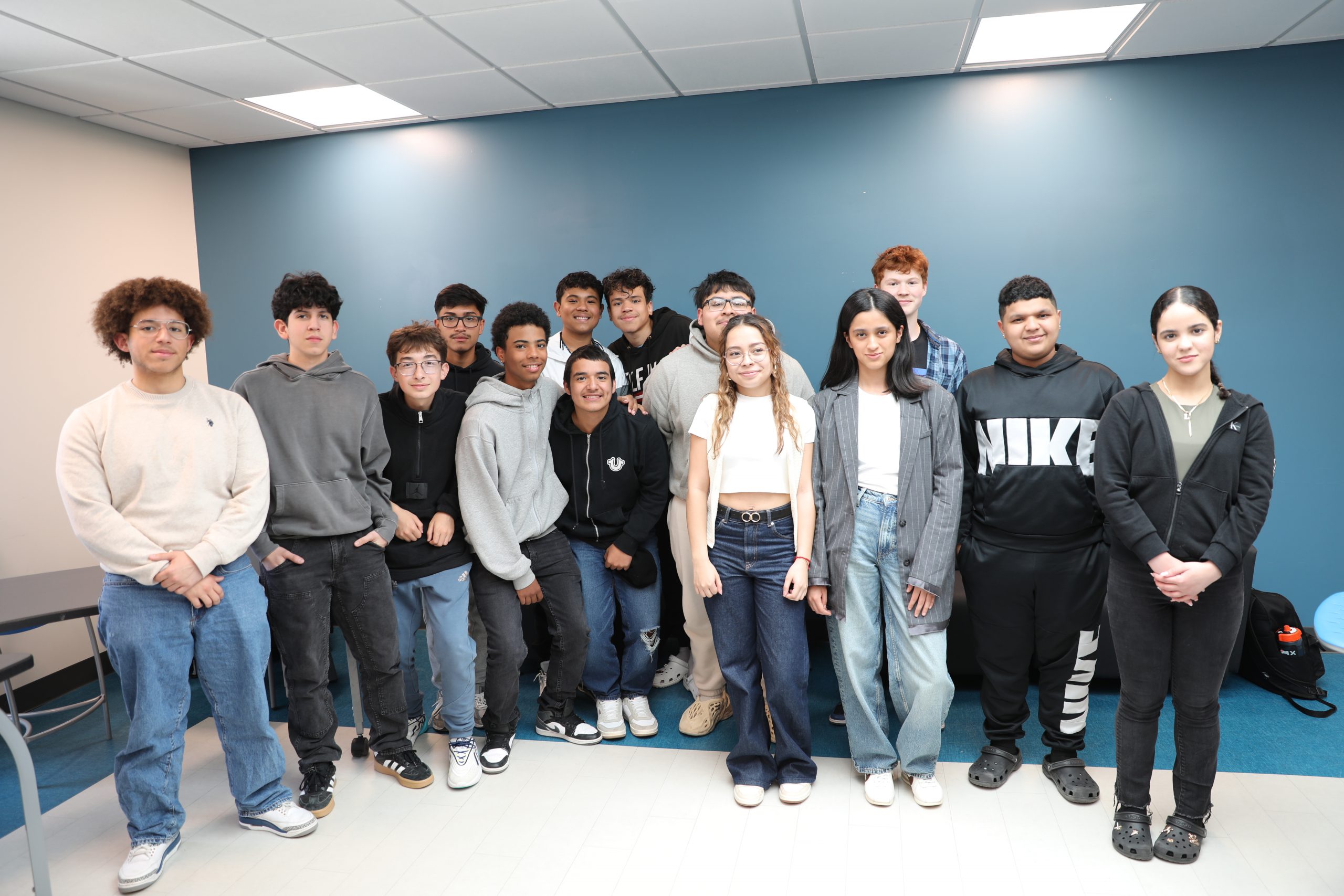 a group  of students smile for the camera