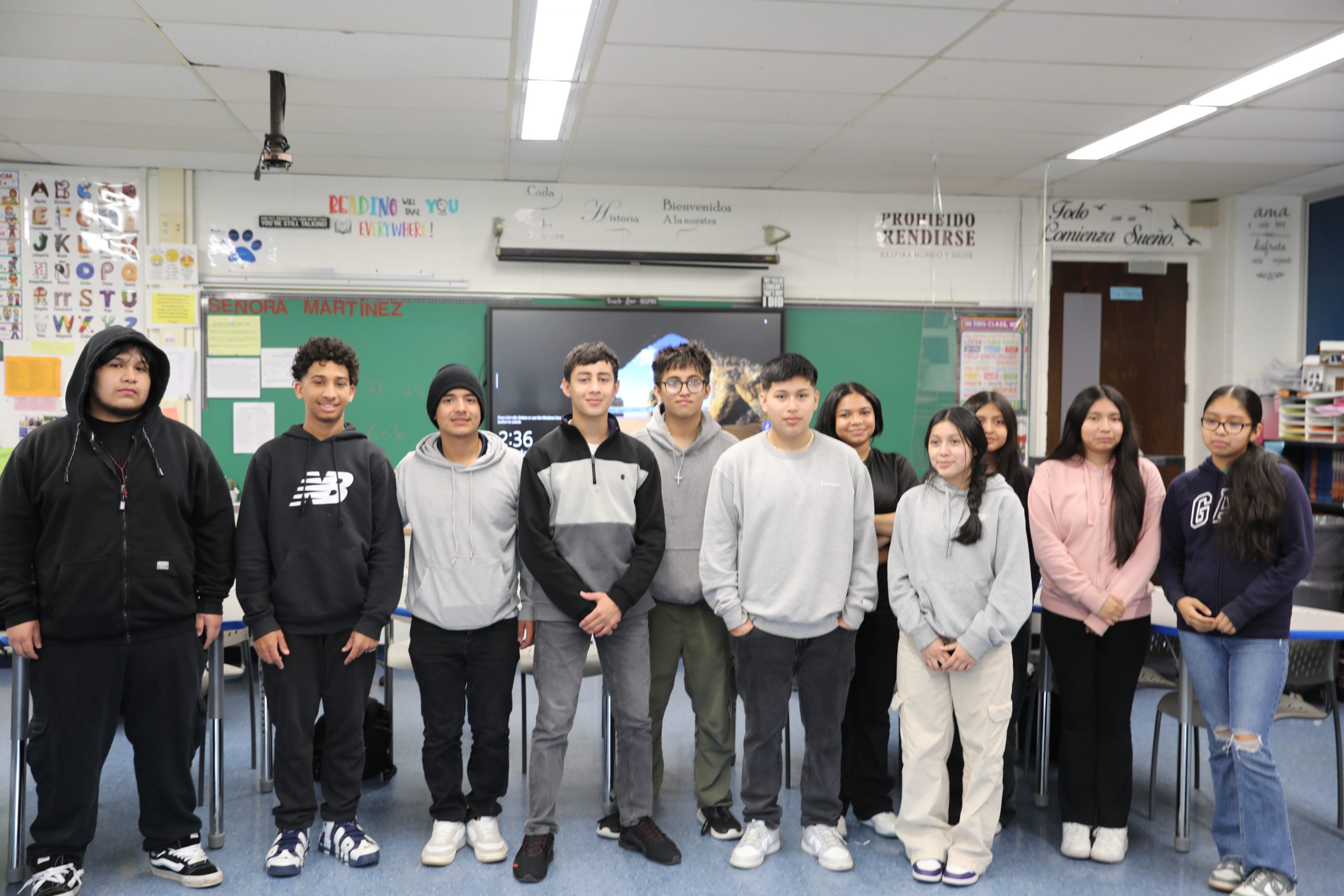 a group of students smile for the camera