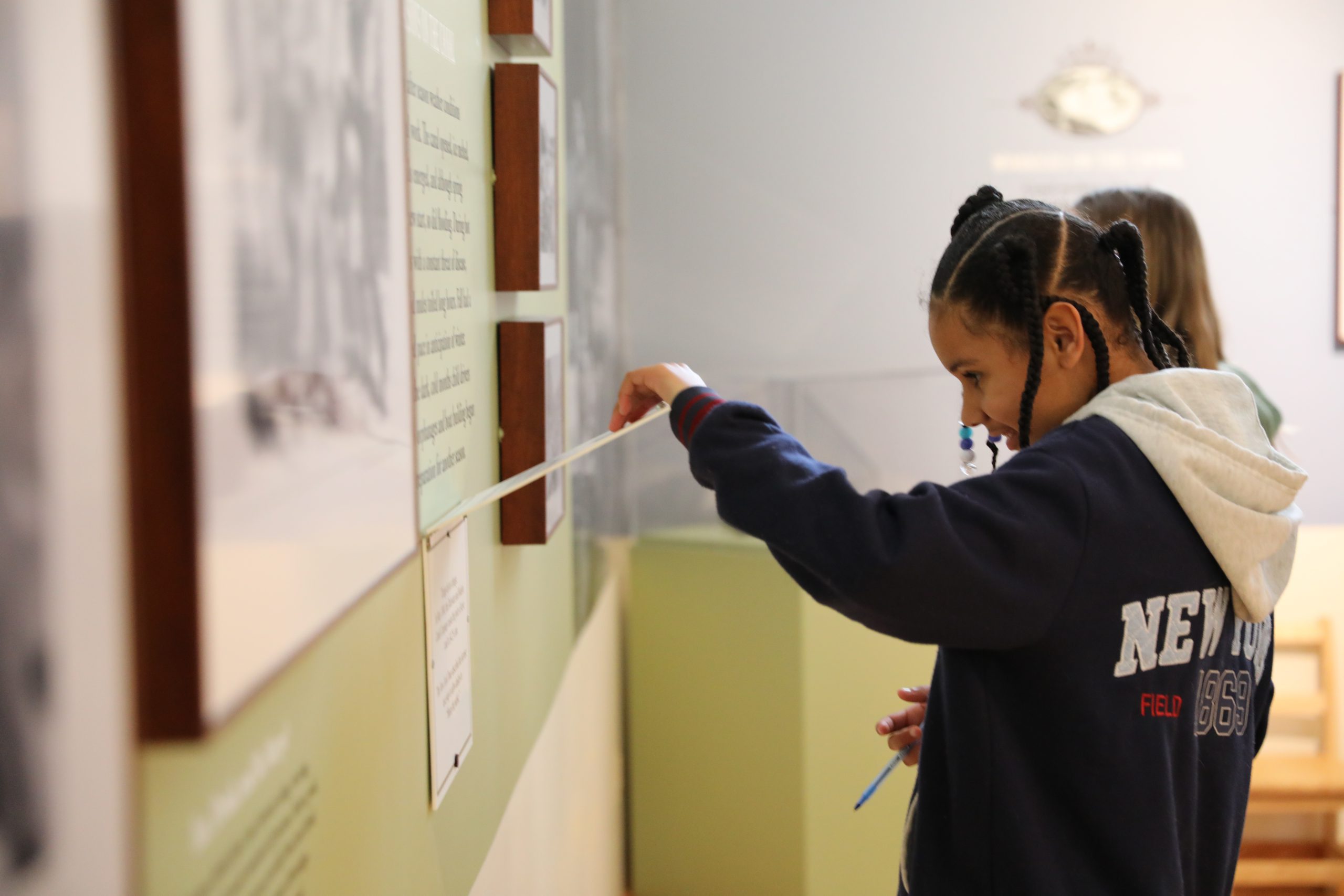 a student interacts with a display at the interpretive center 