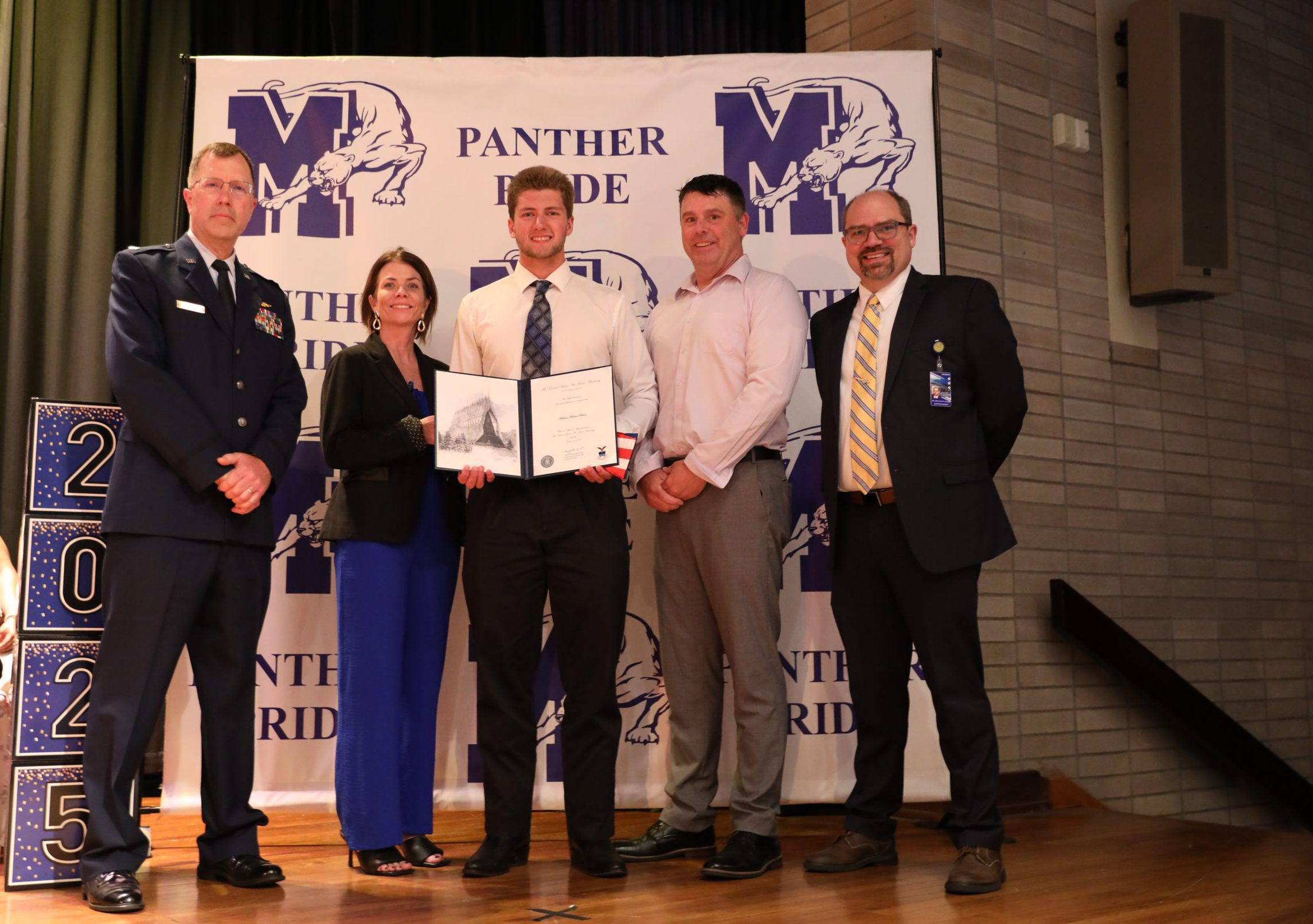 William burns holds his certificate