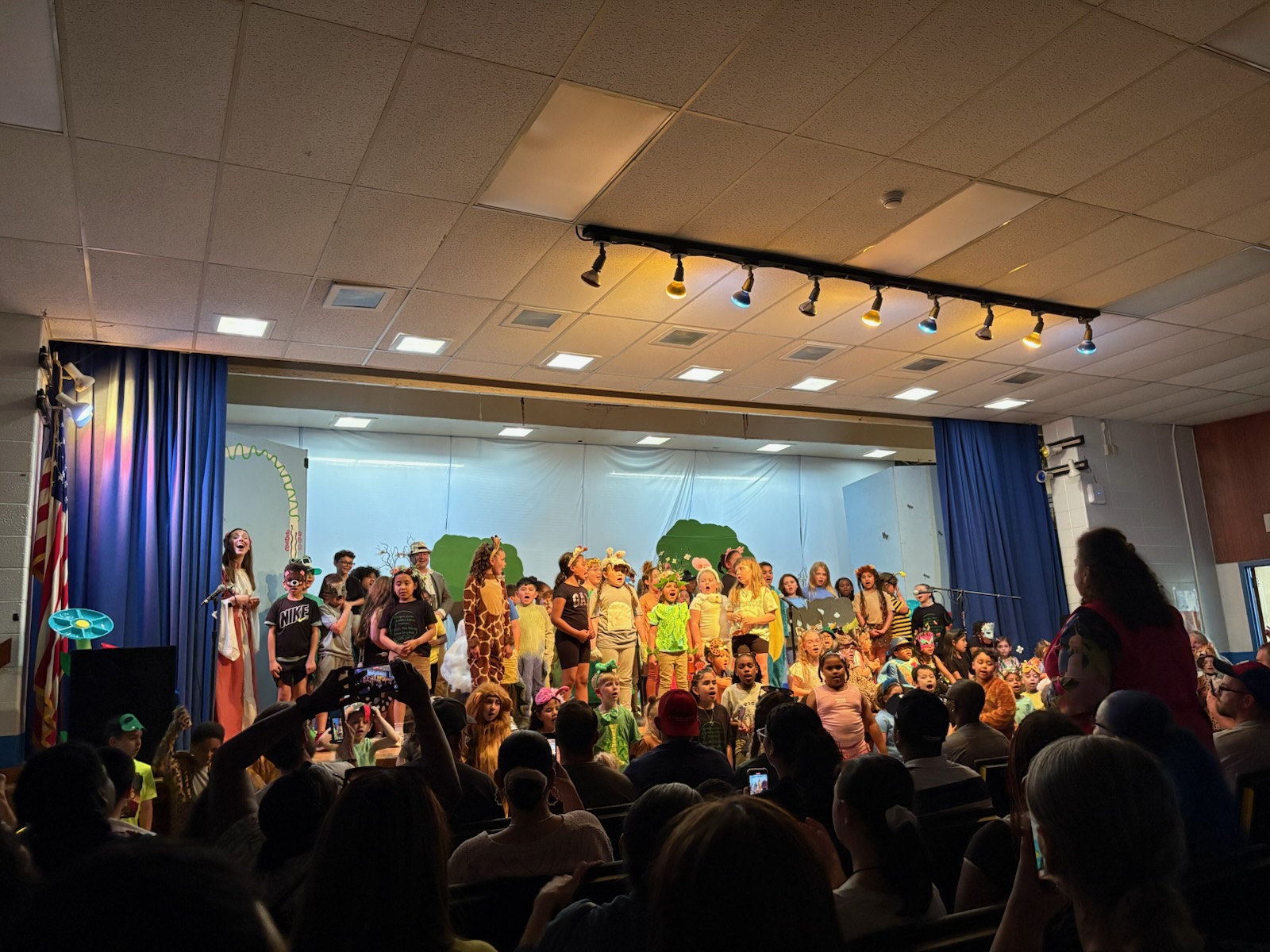 the cast is on stage performing the final song 