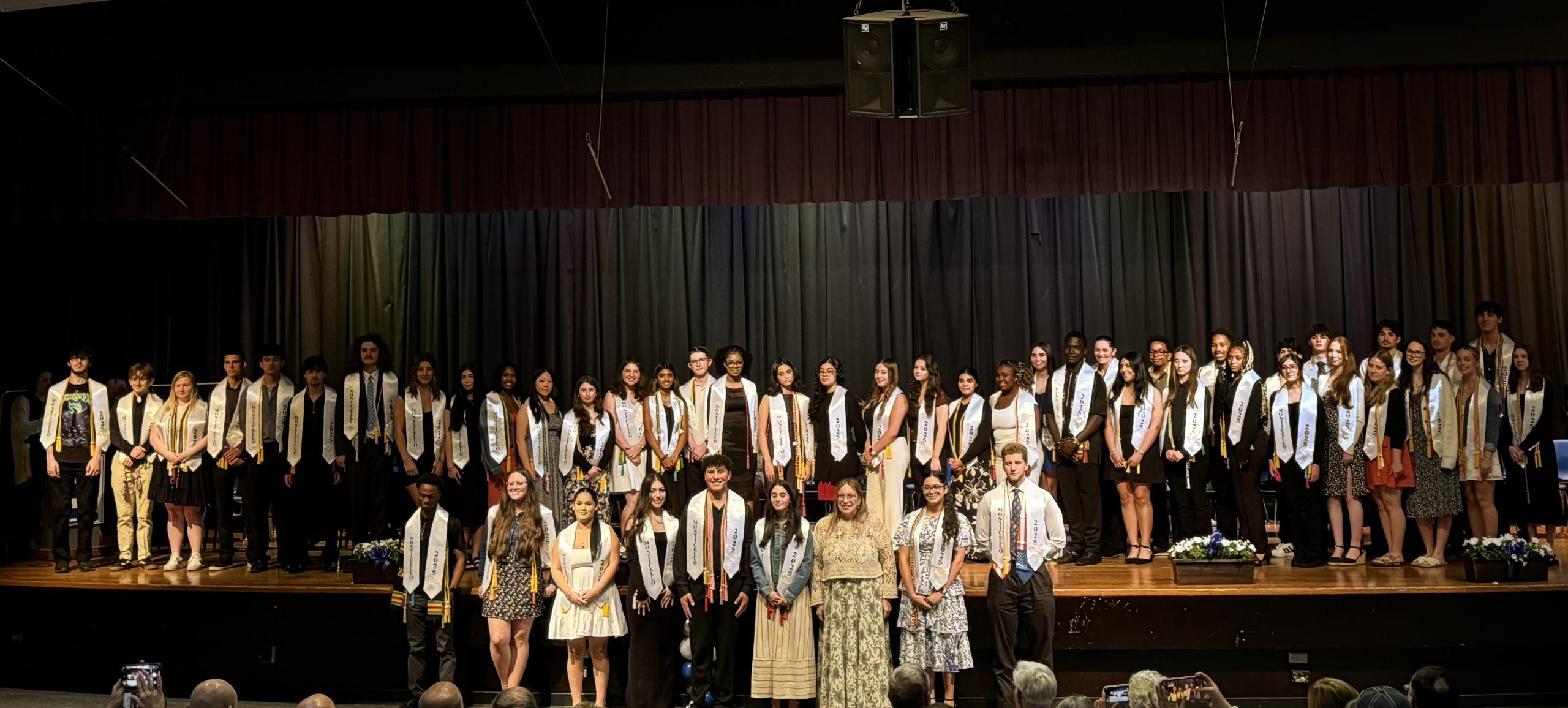members of the National Honor Society on the stage