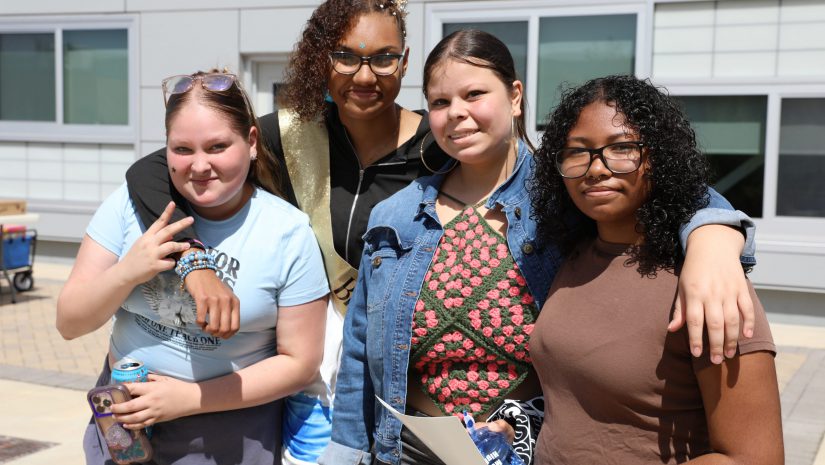 a group of students are posing