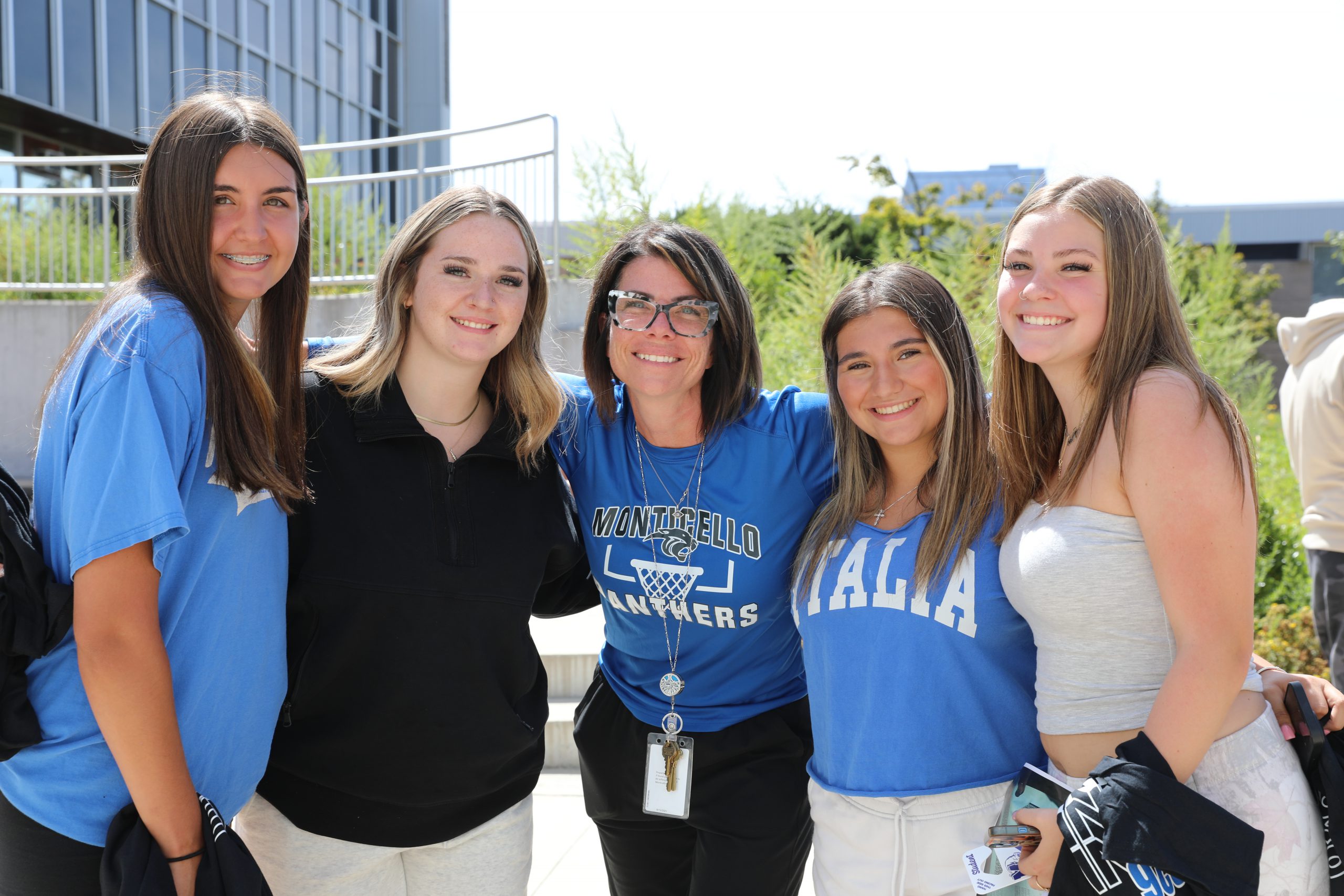 principal gorr poses with students during the senior barbeque