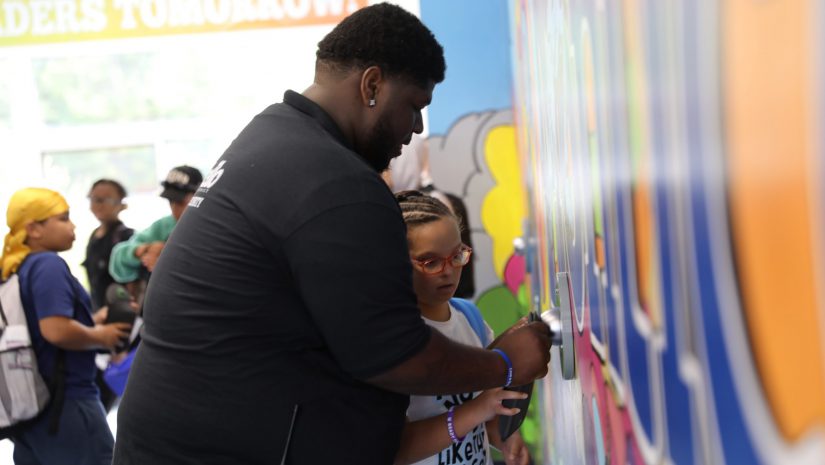 a security guard is assisting a student