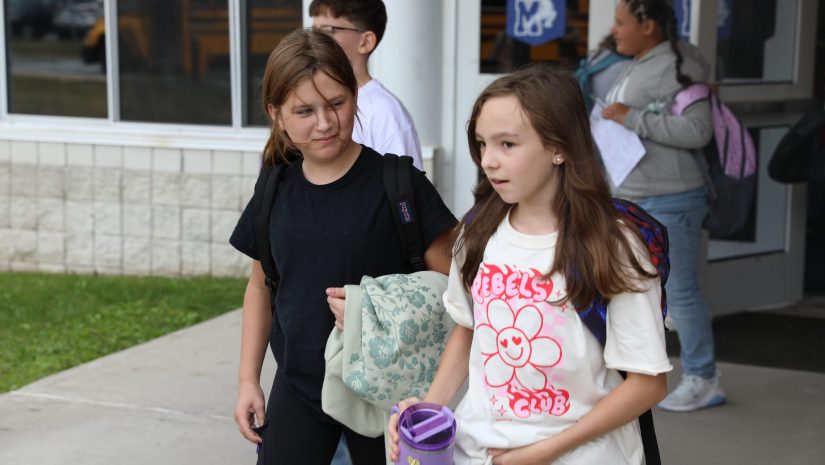 two students are walking