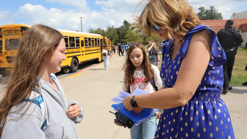 a staff member is speaking with a student