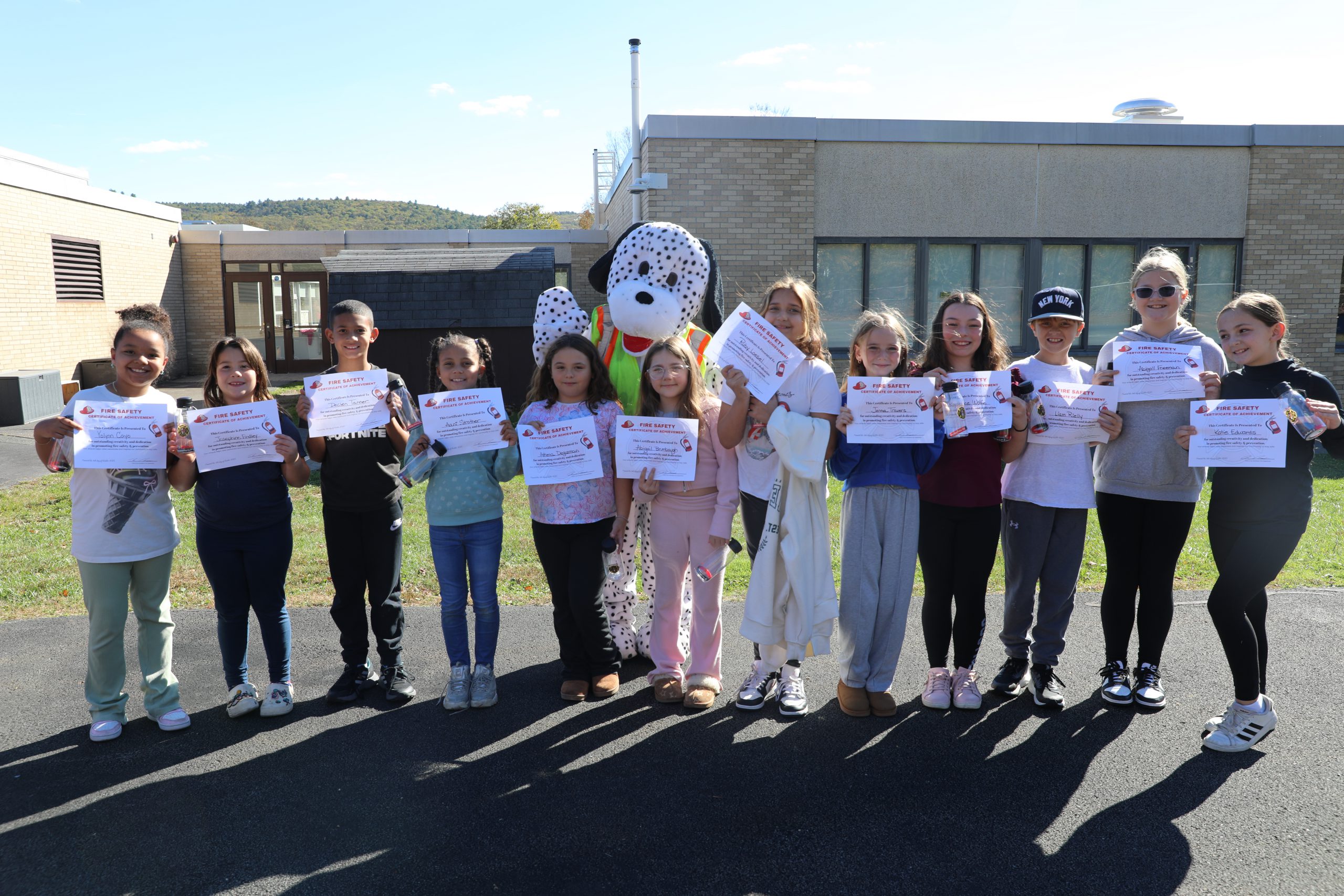 winners of the fire safety essay contest pose