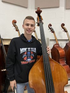 Kenny is holding a bass