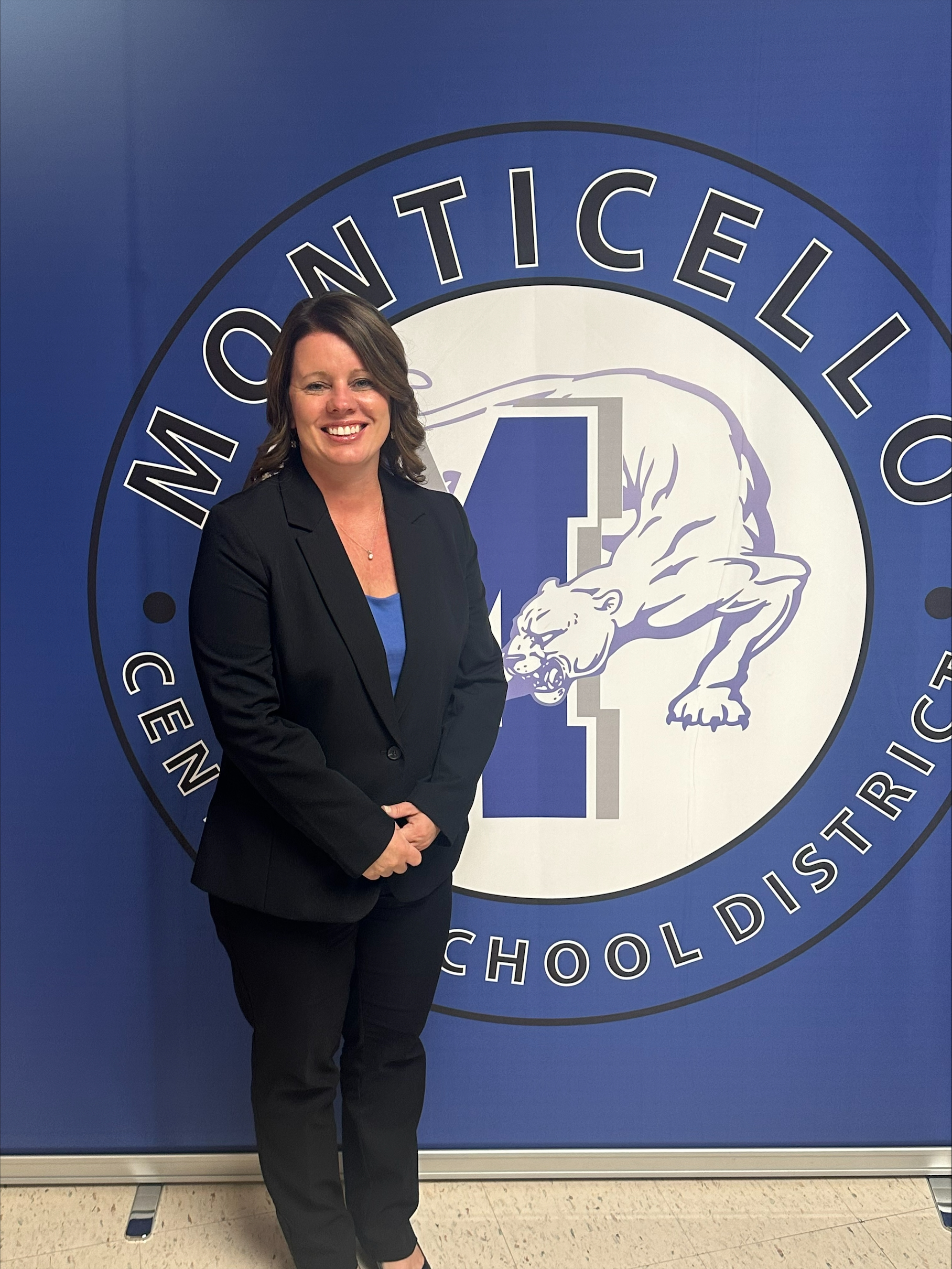 Kimberly Ronaldson is standing in front of a Monticello background 