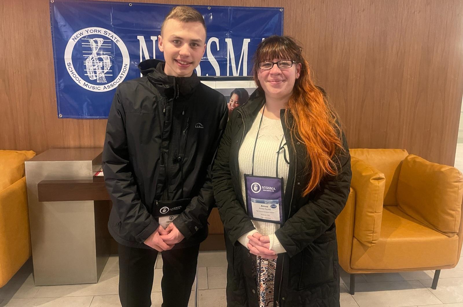 Kenny poses with a teacher