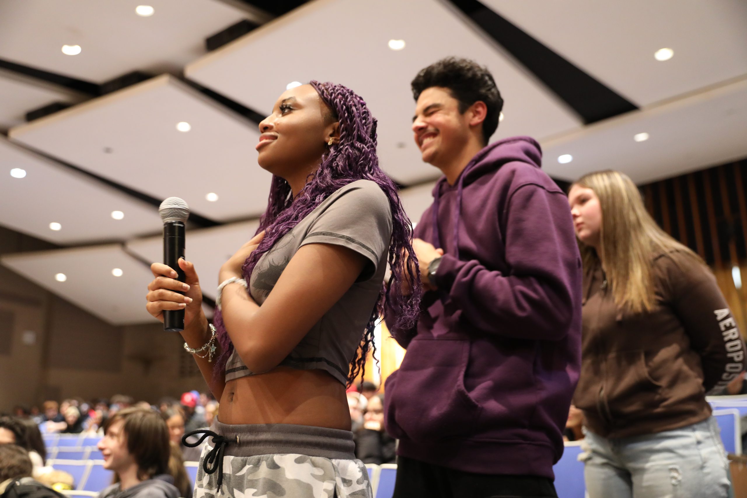students are lined up to ask the panel questions