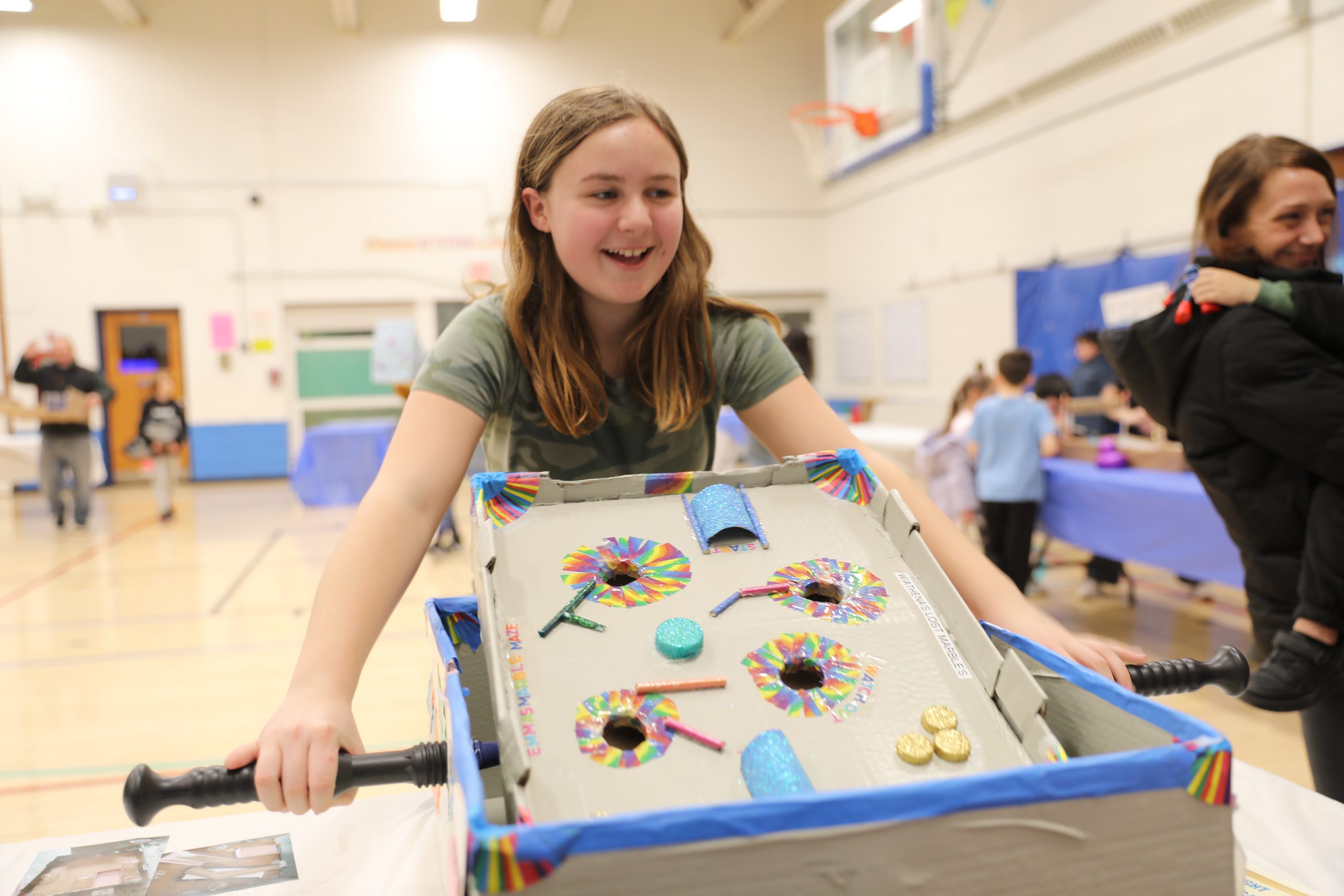 a student plays a handmade game
