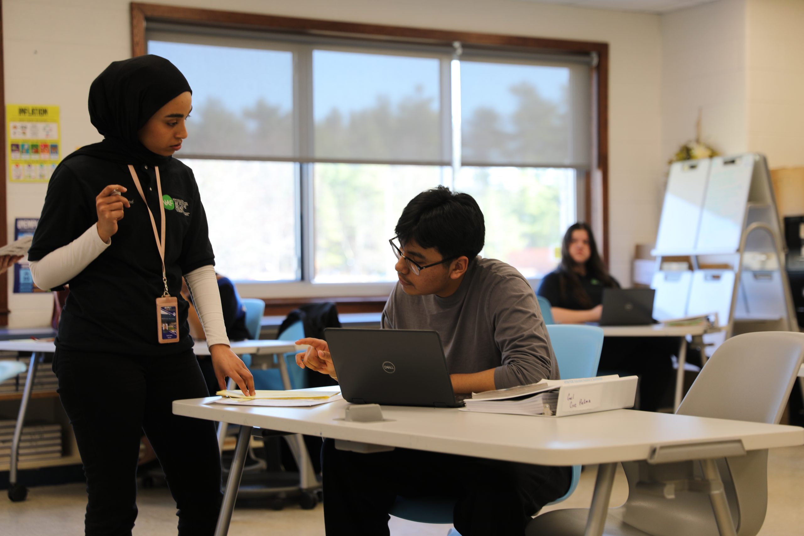 a teacher assists a student