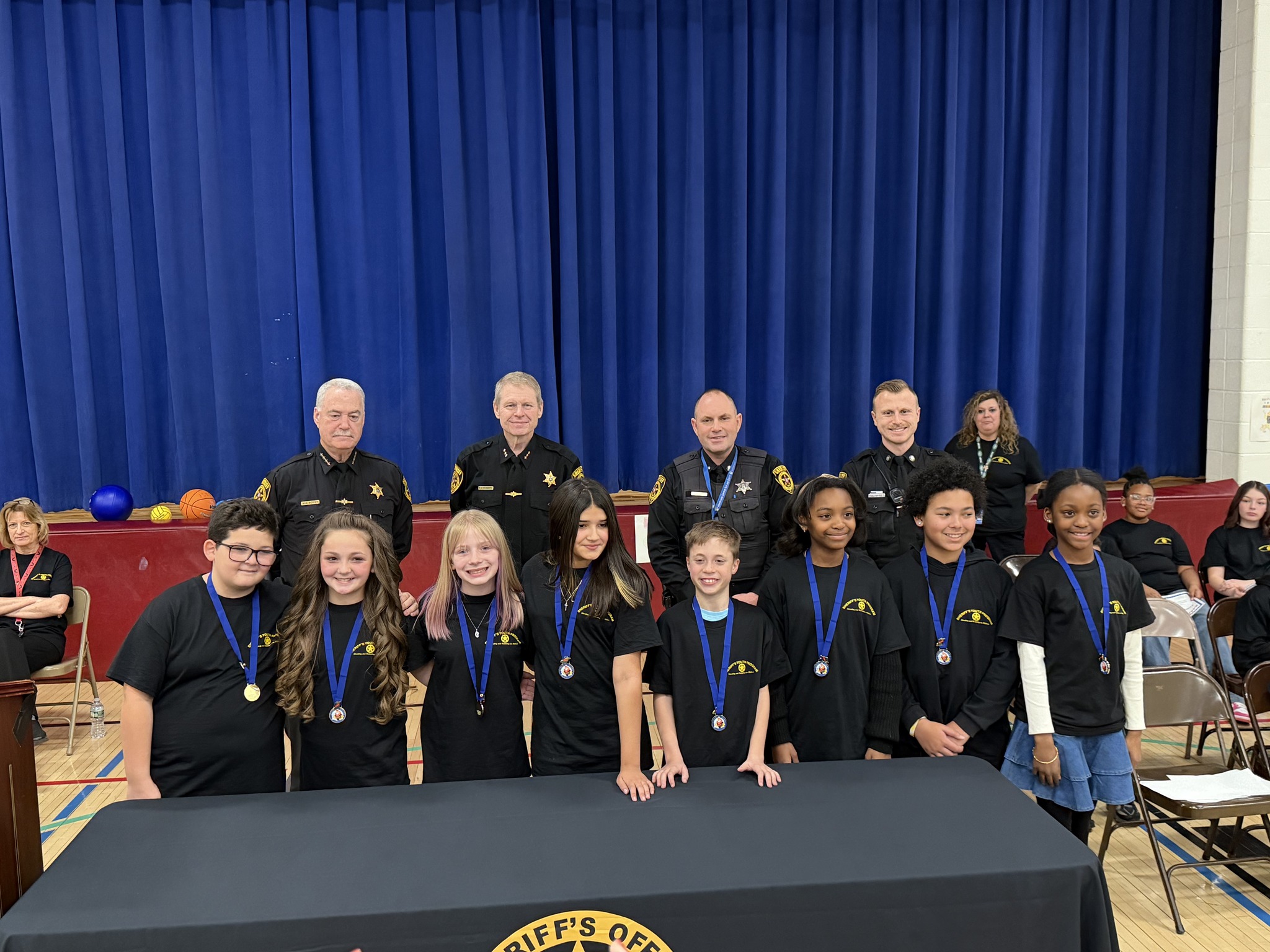 Chase essay contest winners pose with the DARE police officers 