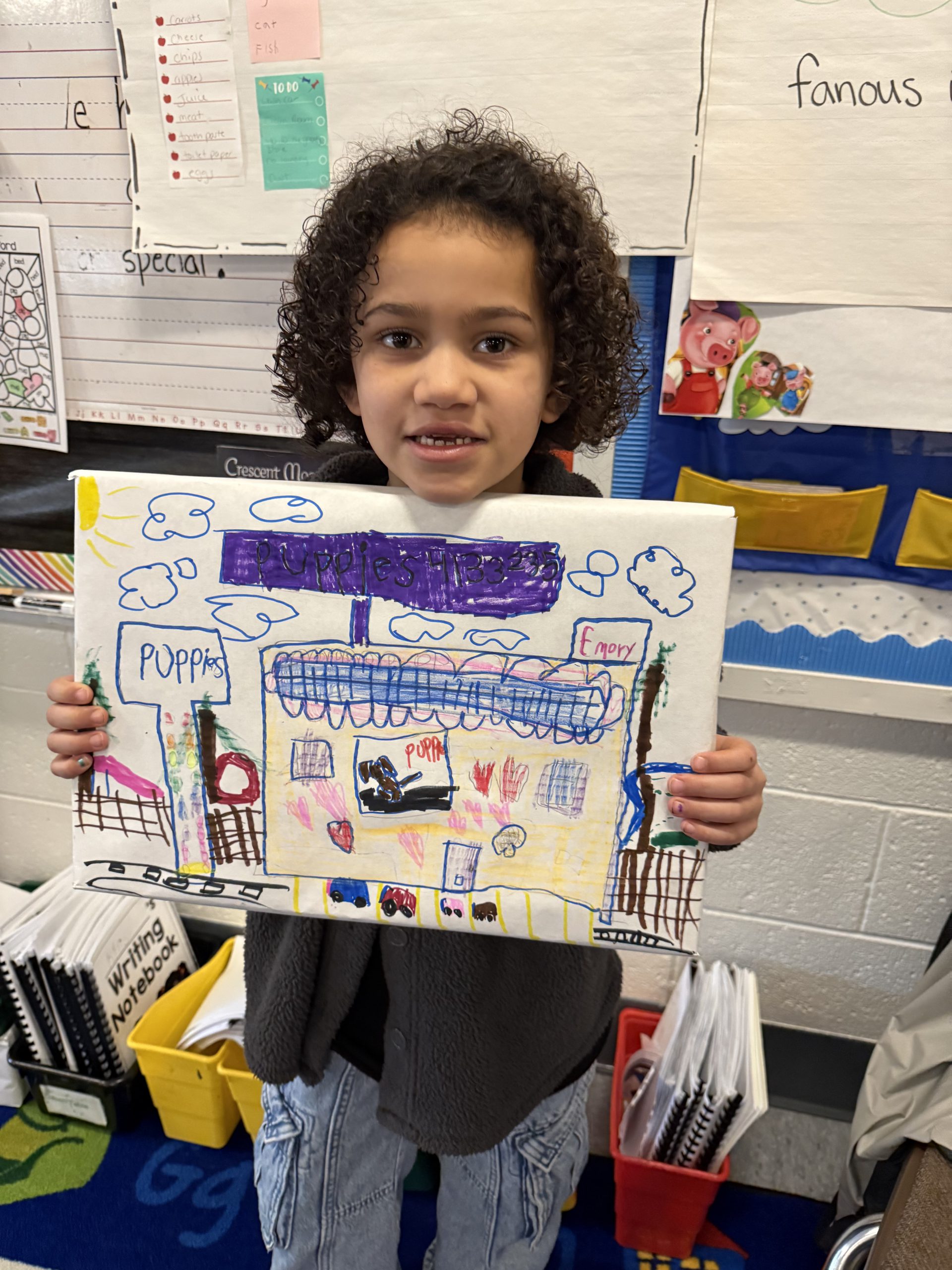 a student holds up her completed box top project