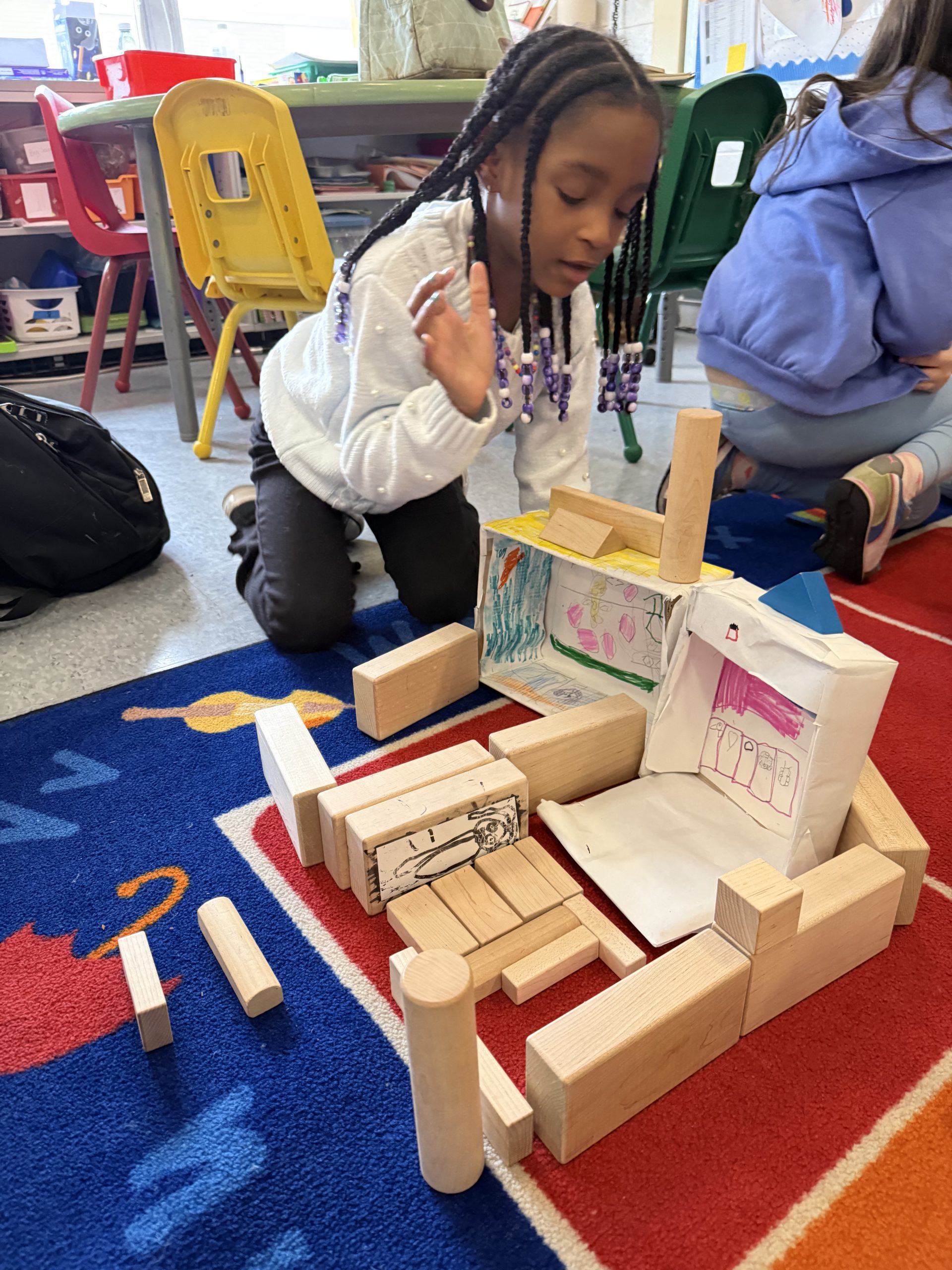 a student plays with blocks