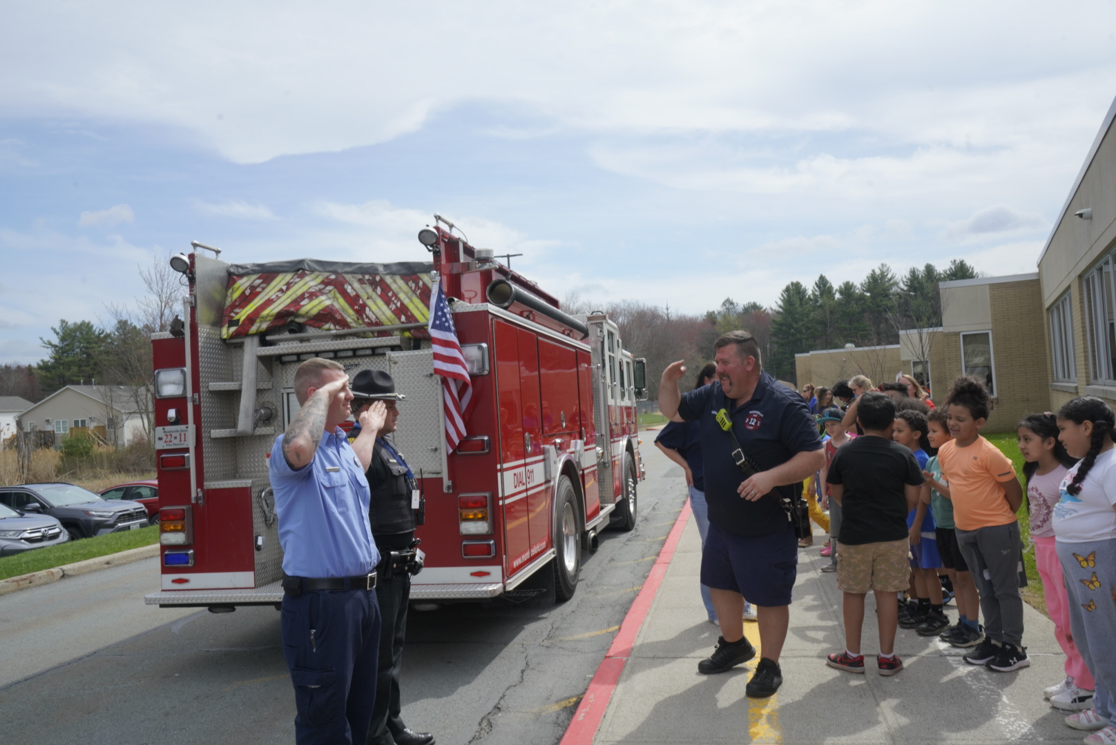 firefighter wayne salutes two other firefighters 