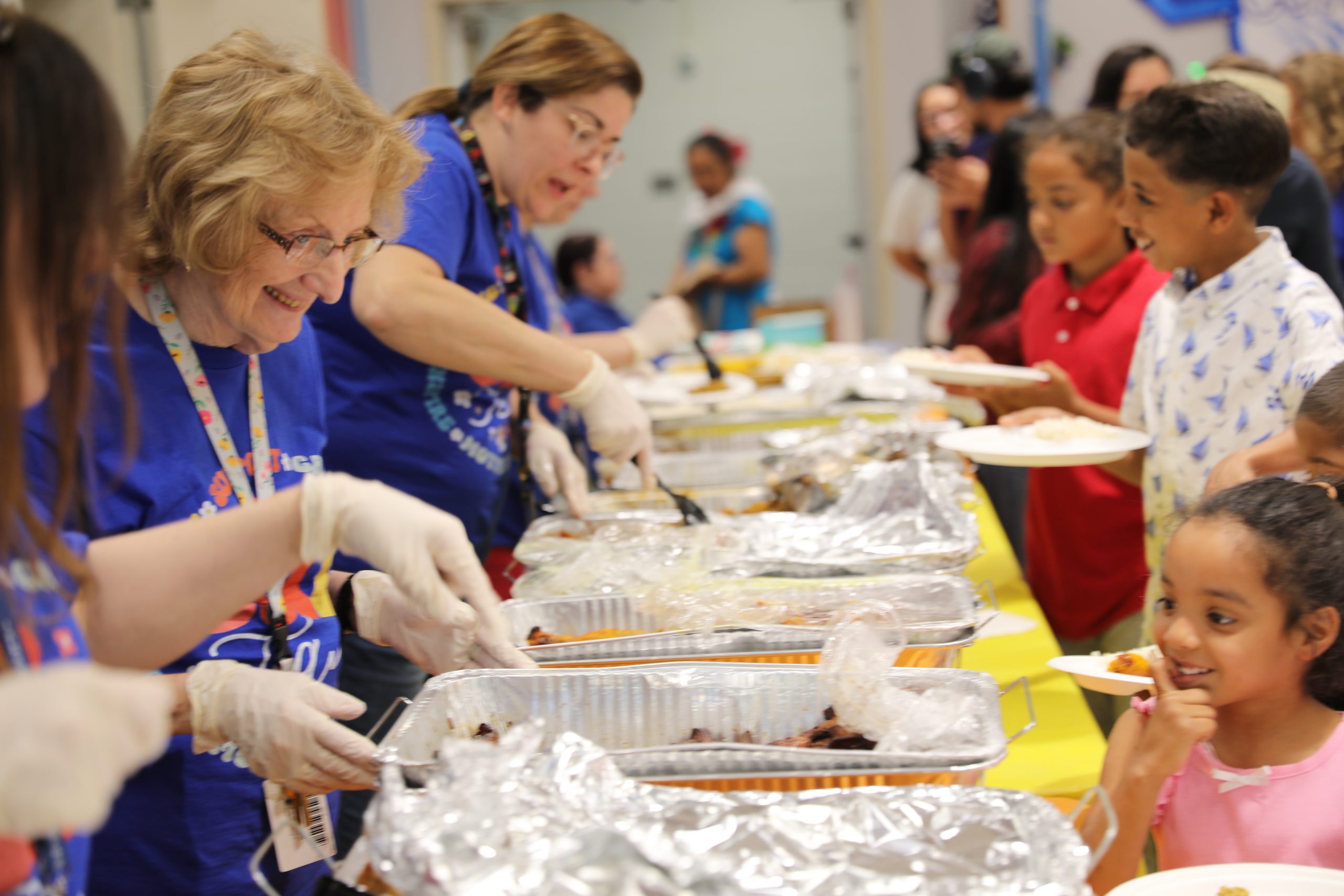 a teacher serves a student food