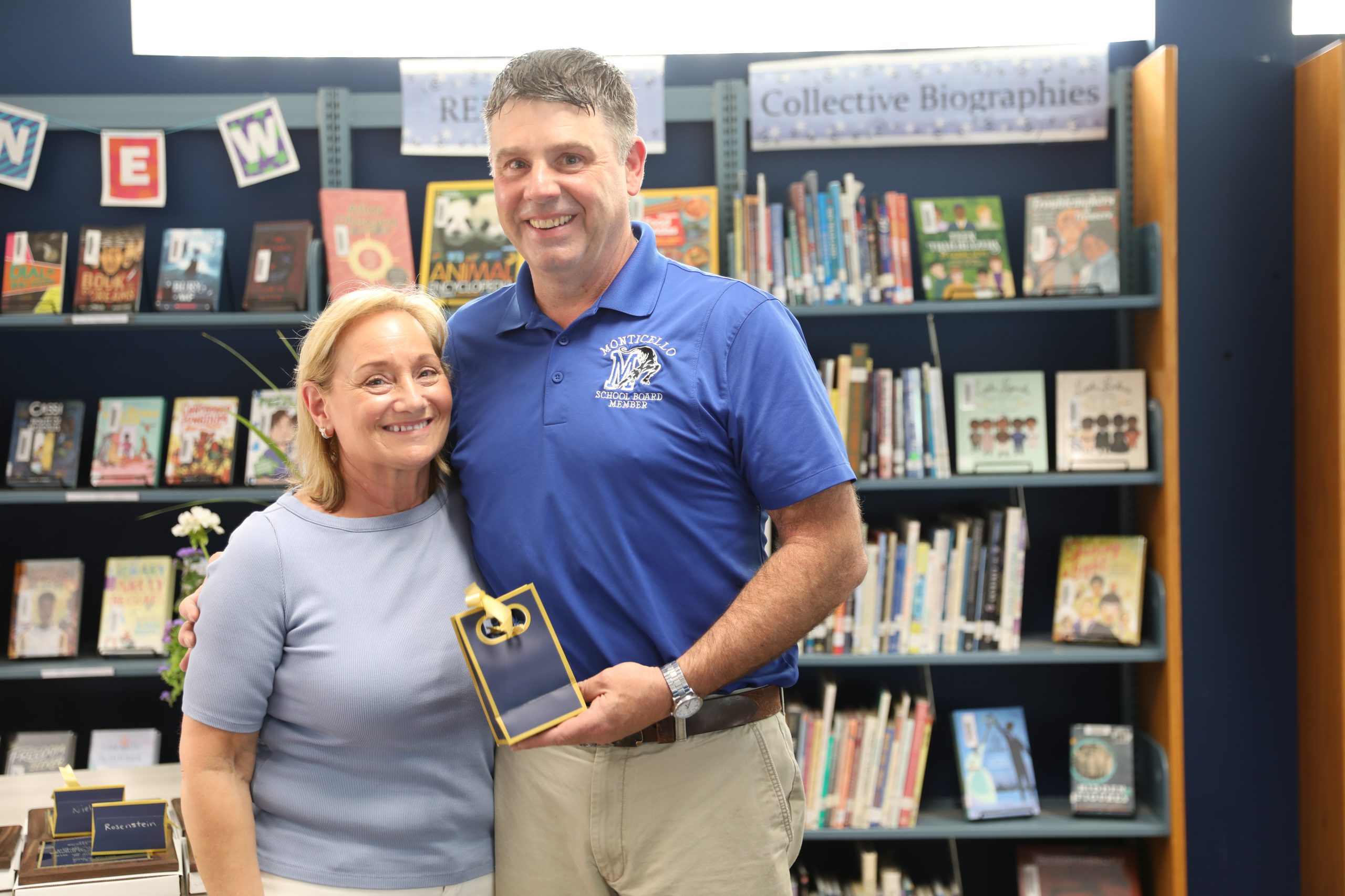 Beth Culligan and Tim Crumley are posing for the camera 