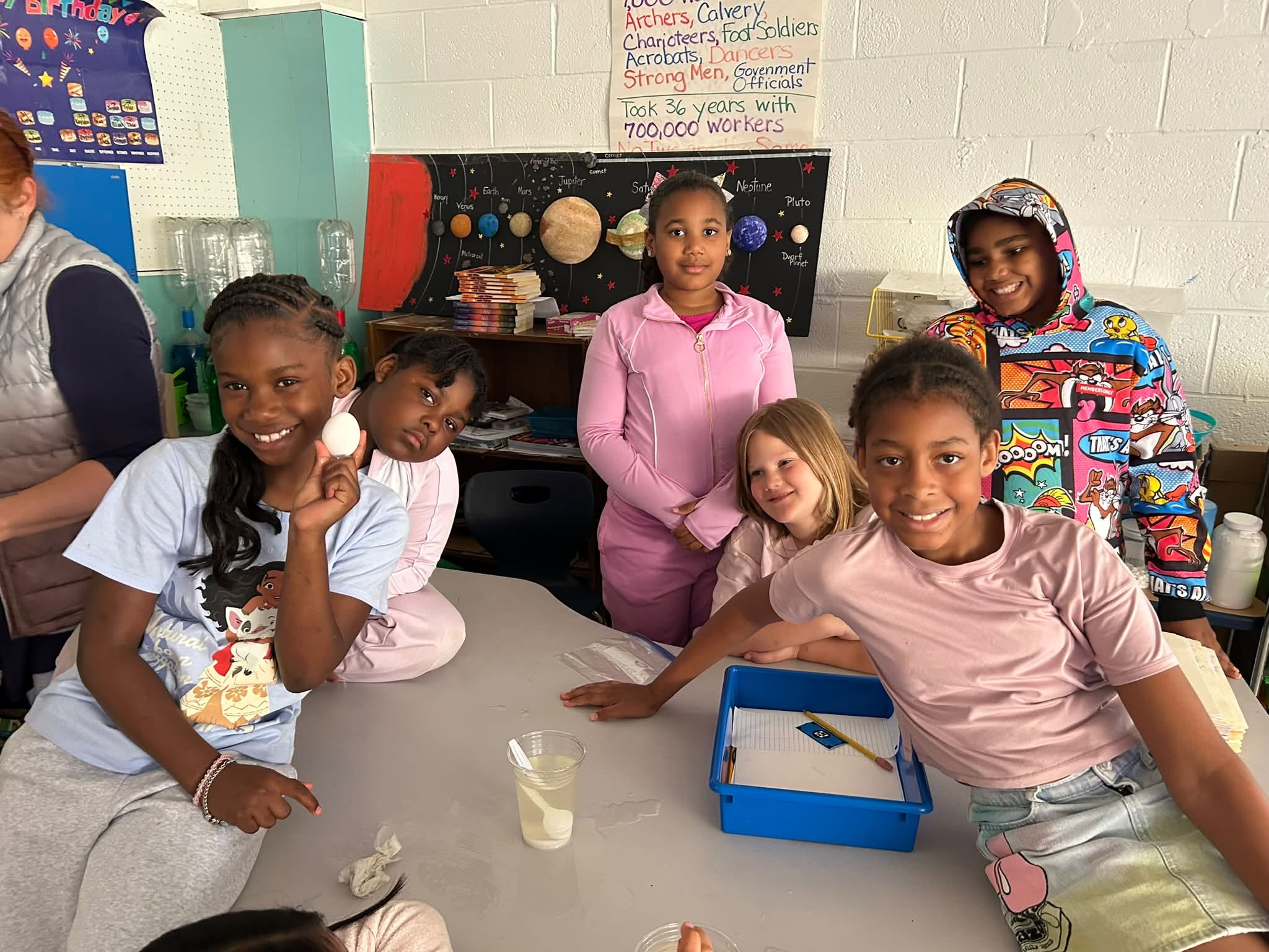 students in the class pose for the camera