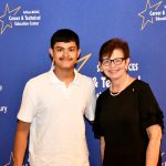 a CTE student poses with their award at the ceremony