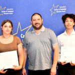 a CTE student poses with their award