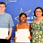 a CTE student poses with their award at the ceremony