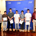 a CTE student poses with their award at the ceremony