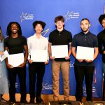 a CTE student poses with their award at the ceremony