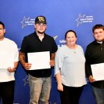 a CTE student poses with their award