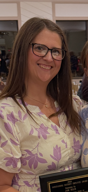Ms. Welch smiles for the camera
